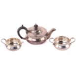 An Edwardian silver three piece tea set, Robert Stewart, London 1910, of compressed form, 631g