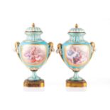 A pair of Sevres bleu celeste style porcelain vases, 19th century, with finely painted panels of