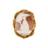 A large Victorian shell cameo brooch, depicting a Classical scene of Hebe feeding the Eagle of Zeus,