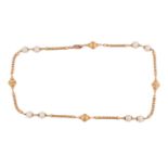 A fancy link chain with cultured pearls, comprising sections of popcorn links, flanked by