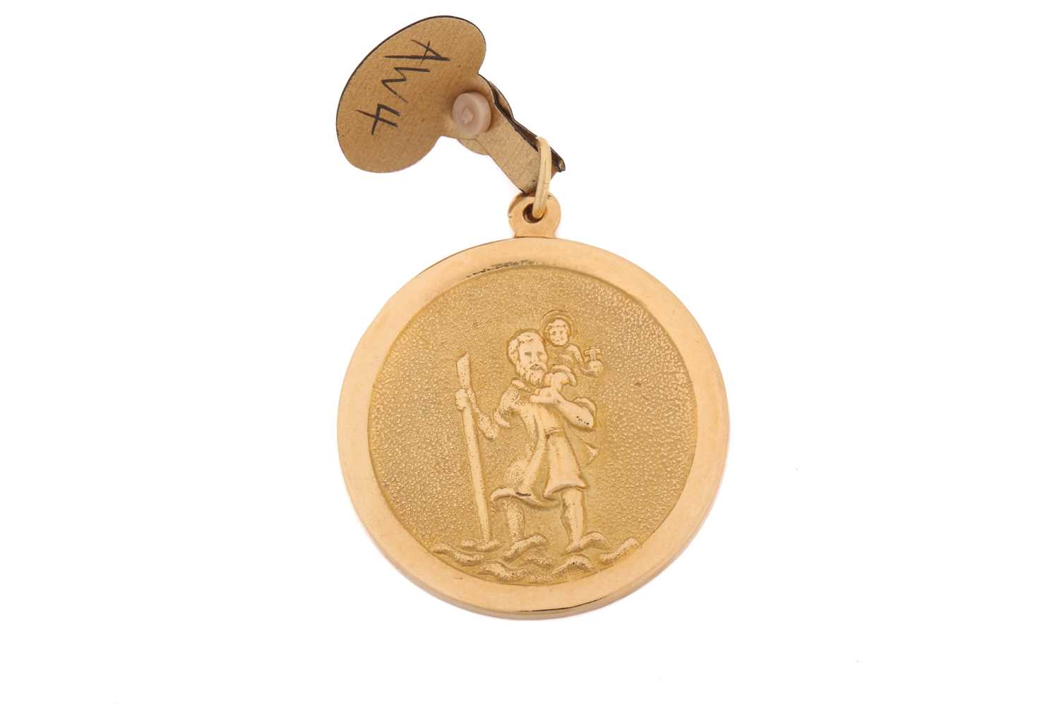 A St. Christopher pendant in 18ct yellow gold, cast relief on a circular textured panel, flat