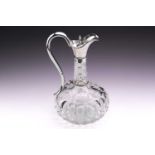 A Victorian silver mounted cut glass claret jug; low bellied with beaded silver mounts and beaded