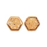 A pair of 22ct yellow gold stud earrings, each consisting of a domed floral motif in the centre,