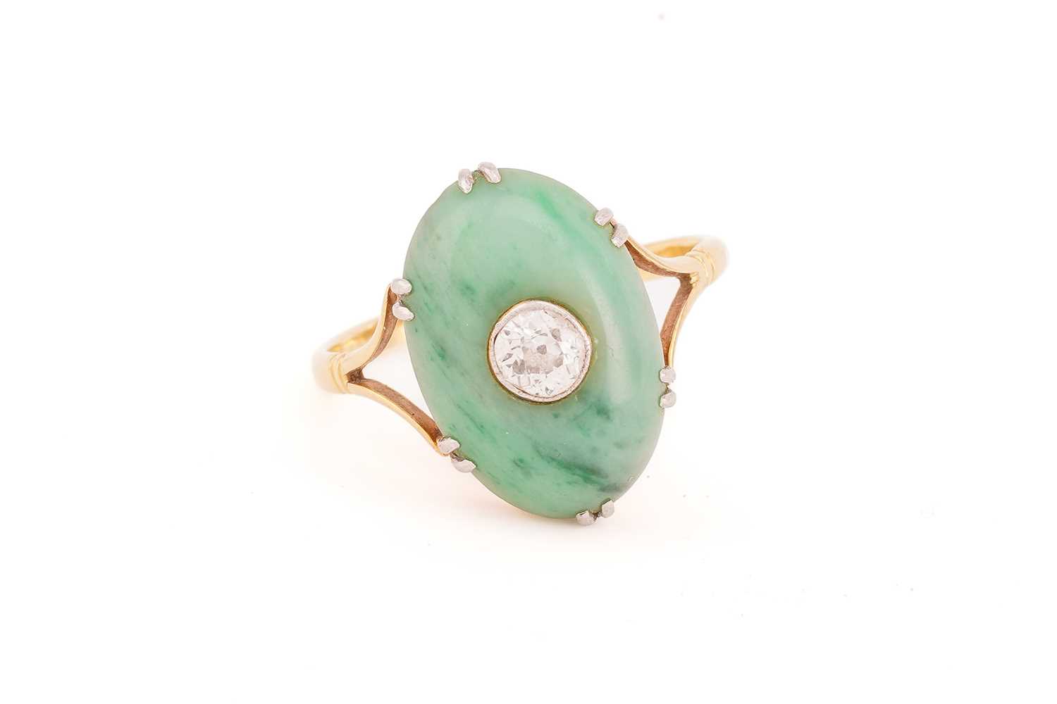 A jade and diamond ring, the oval jade cabochon measuring approximately 17 x 12mm, centred by an old - Image 2 of 9