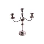 A George V silver three-branch candelabra, of tapering octagonal form, with detachable centre