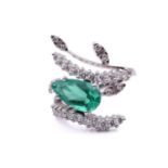 An emerald and diamond cocktail ring, featuring a pear-shaped emerald with bright bluish-green