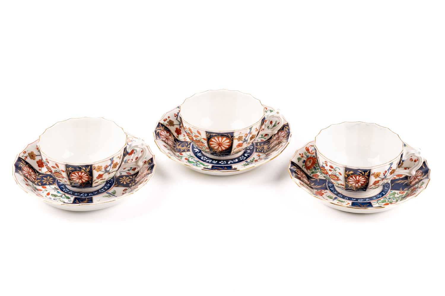 A group of three Worcester porcelain "Kakiemon" pattern tea cups and saucers, c 1770s, with shaped