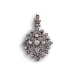 A Victorian floral pendant brooch set with old-cut diamonds, the lozenge-shaped design scintillating