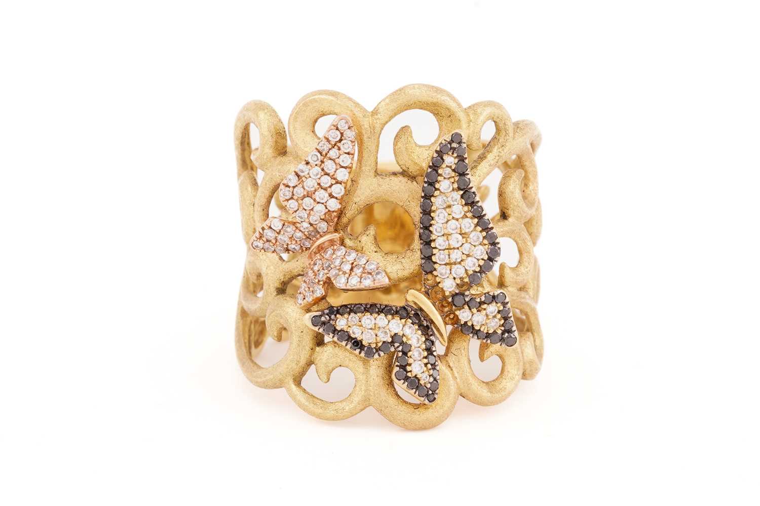 A diamond butterfly design dress ring, the satin finish yellow gold scrollwork mount accented with