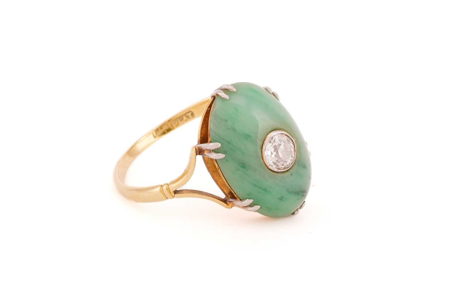 A jade and diamond ring, the oval jade cabochon measuring approximately 17 x 12mm, centred by an old - Image 4 of 9