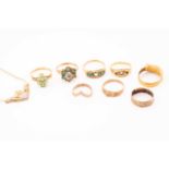 A collection of five 9ct gold rings, three 18ct gold rings, a necklace with an integral heart and