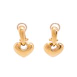 A pair of heart drop earrings, each comprising a heart-shaped charm on a bar surmount, fitted with