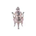 A Chinese silver censer, Qing, 19th century, the cover with an elephant supporting an urn of