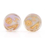 Chanel - A pair of holographic clip-on earrings, each containing a round tabular resin, inset with