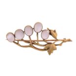 An Art Nouveau-style moonstone vine brooch, consisting of five moonstone cabochons set against