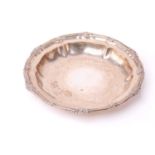 A Victorian silver pie-crust shaped dish, by Garrards, with scroll cast edge, London 1842, maker's