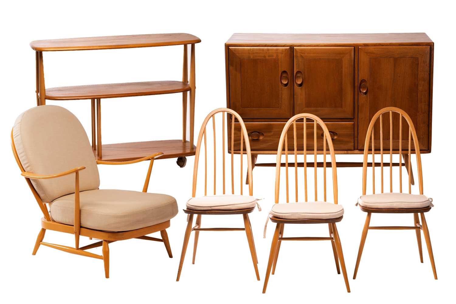 Ercol light ash and beech furniture comprising, a sideboard with a pair of cupboard doors over a