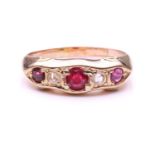 A ruby and diamond five-stone graduated half hoop ring, the circular cut rubies and rose cut