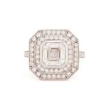 An Art Deco style diamond ring, the central Asscher cut diamond within a two-row surround of round