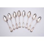 A set of eight Victorian silver table spoons, with foliate casting and engraved crest, London