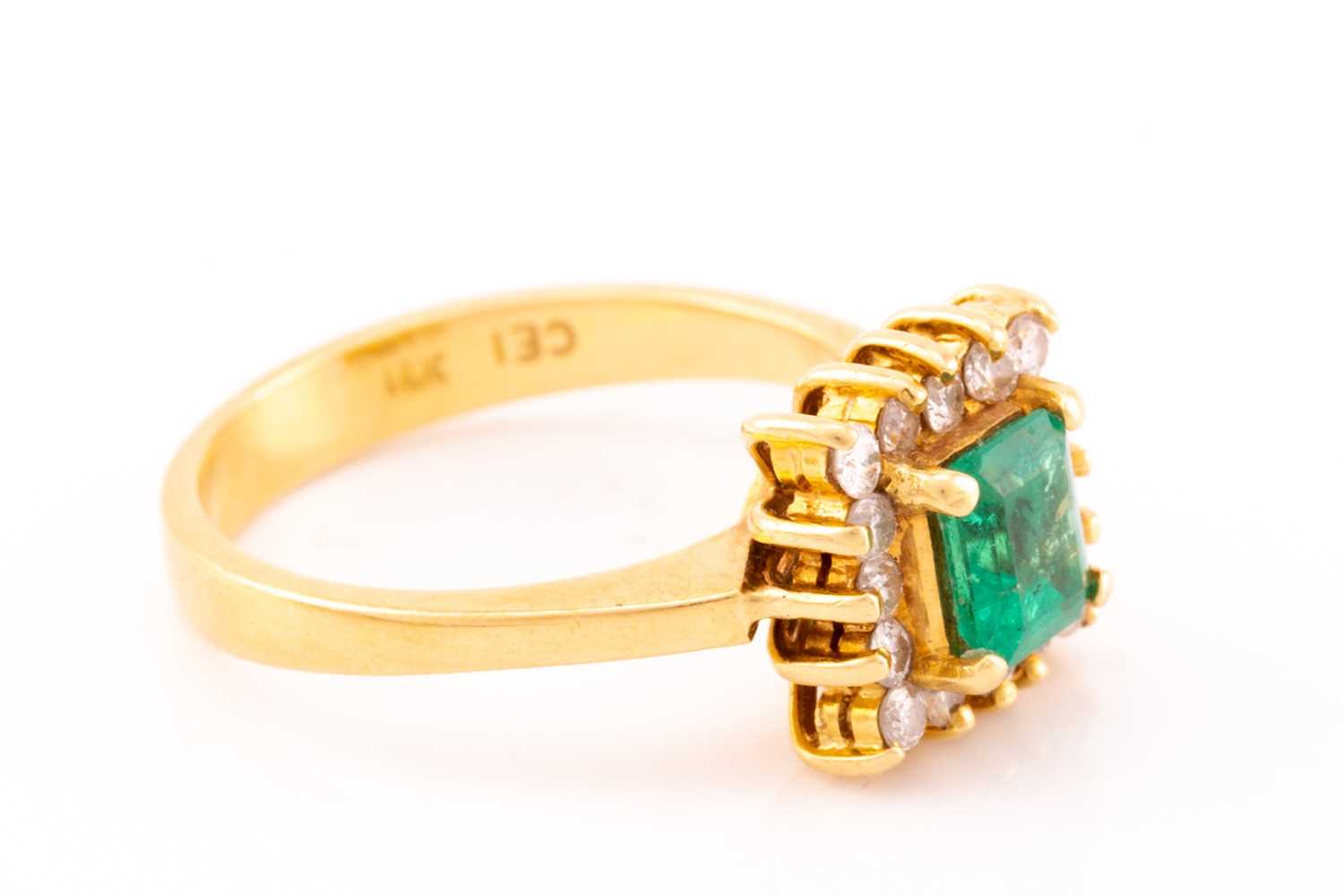 An emerald and diamond entourage ring, centred with an emerald-cut emerald in bright green colour, - Image 3 of 5