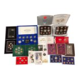 A collection of boxed and mostly presentation-cased United Kingdom and Other proof coin sets