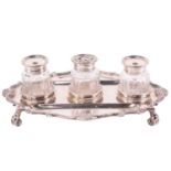 A late Victorian silver desk standish, Robert Stewart, London 1896, with three facet cut and