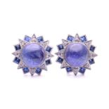 A pair of sapphire, diamond and cabochon tanzanite cluster earrings; of overlapping star design with