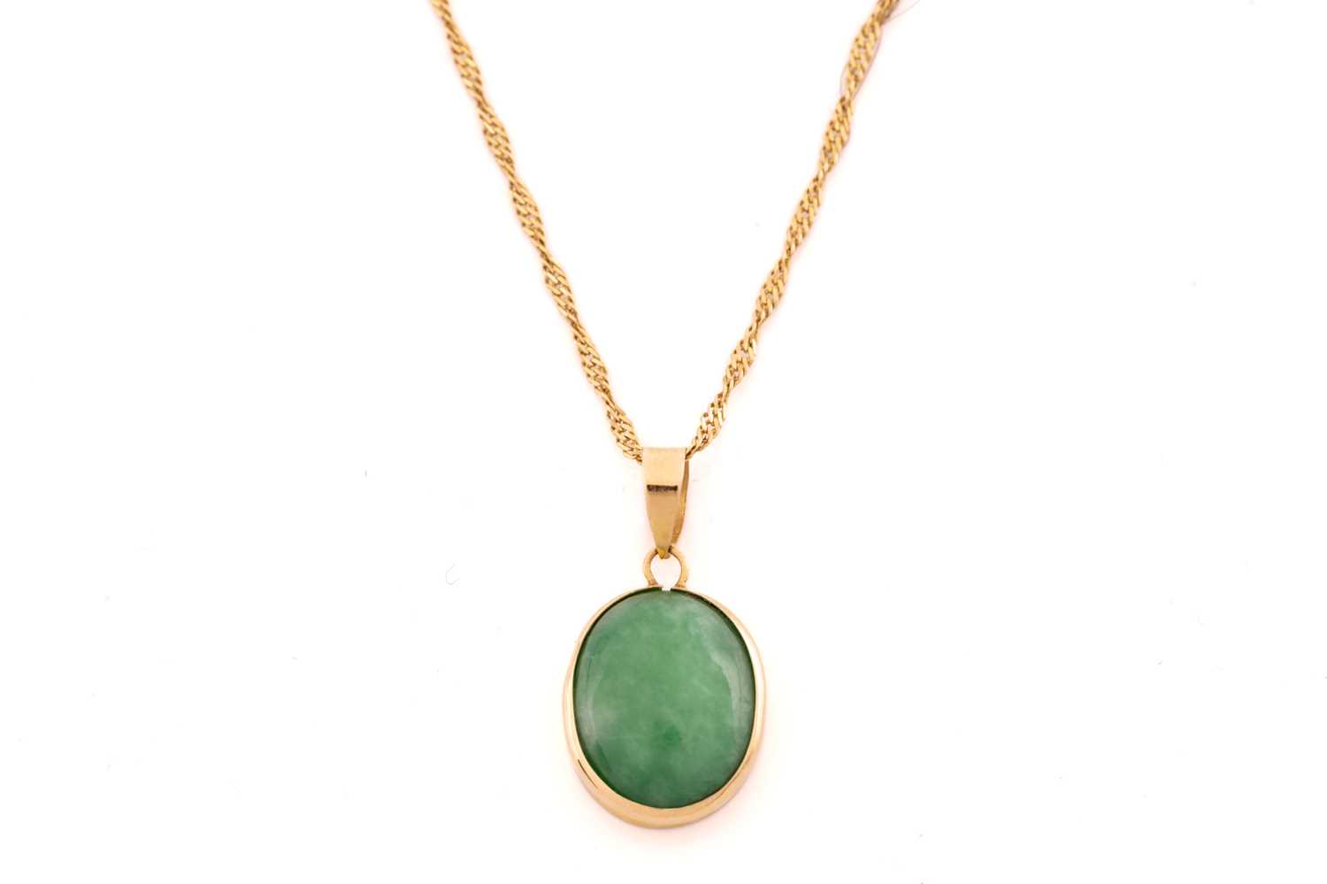 A jade pendant on chain with a pair of stud earrings in 18ct yellow gold; the pendant contains an - Image 3 of 10