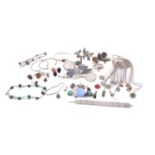 A mixed collection of jewellery and trinkets, including a necklace with malachite bead