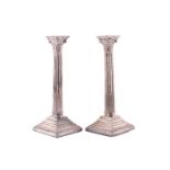 A pair of Victorian silver table candlesticks, Walker & hall, Sheffield 1896, with Corinthian