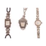 Two lady's cocktail watches and a cut steel lantern watch brooch, the first features a hand-wound