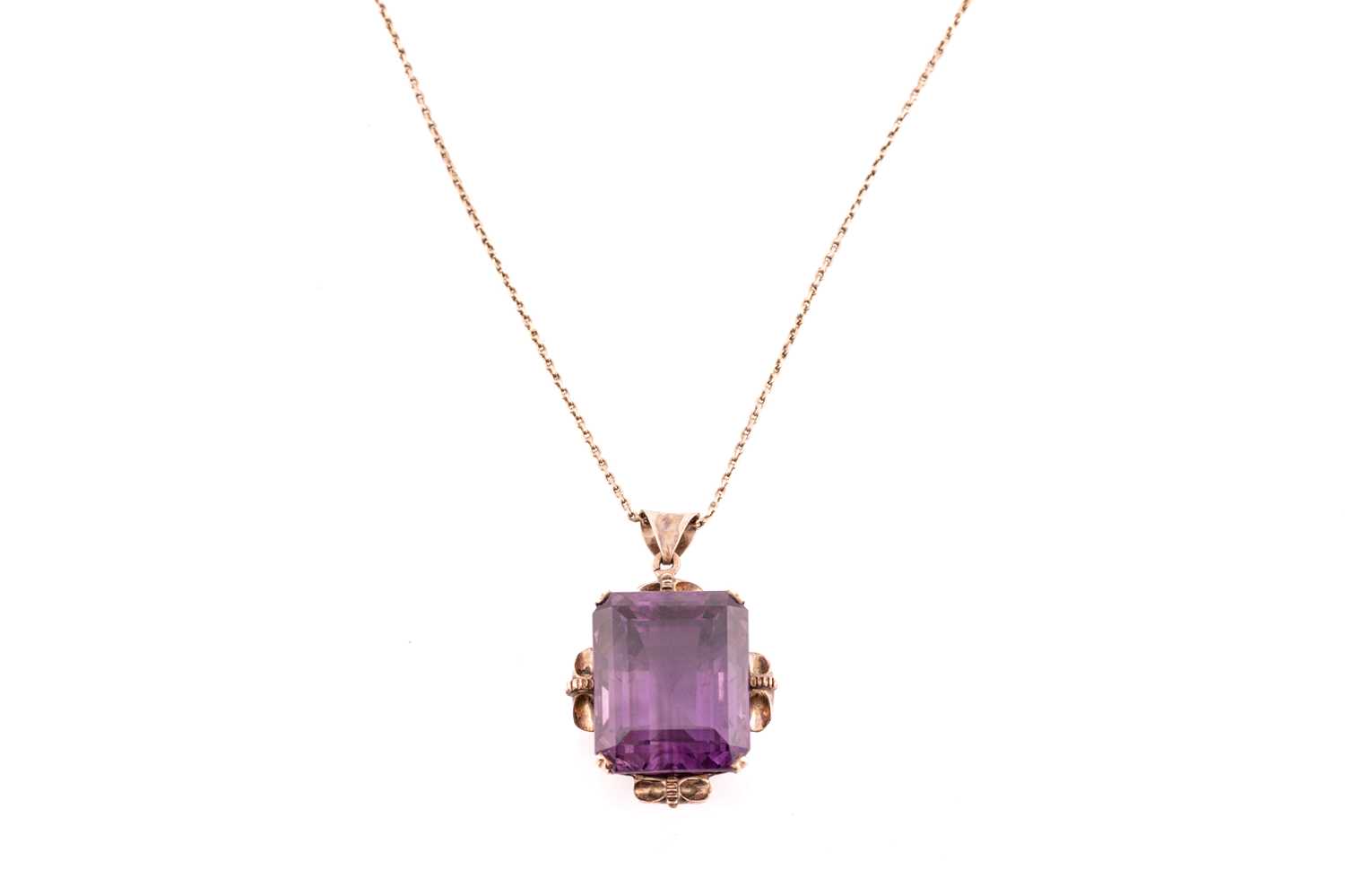 A large amethyst pendant on chain, contains an octagonal step-cut amethyst of 19.6 x 15.9 x 14.2 mm,