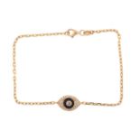 An evil eye bracelet, consisting of a glass Nazar / evil eye, encrusted with diamond accents,