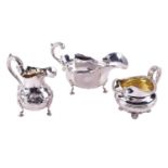 A William IV silver creamer, of baluster form with floral chased decoration and scroll handle, on