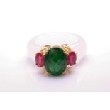 A carved white nephrite jade ring set with tsavorite and rubies, with a D-section band carved out of