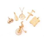 A miscellaneous aggregate of 9ct yellow gold items; including a charm in the form of a gentleman