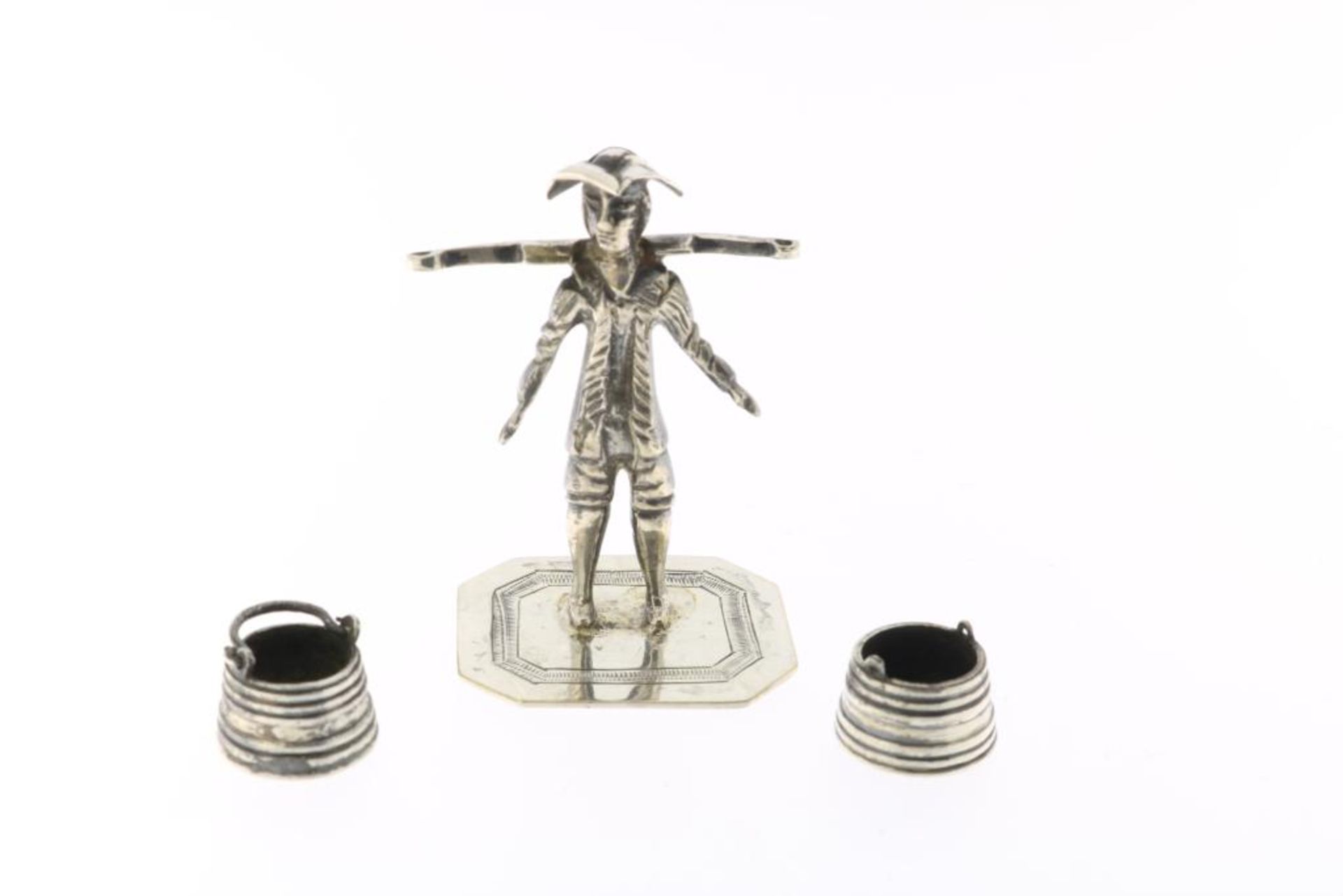 Zilveren miniatuur man met juk, Somerwil