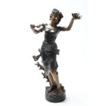 Bronzen sculptuur van dame met vogeltje