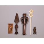 Mossi flute, Zulu hairpin and comb, Tetela knife and a Senufo bronze figure.