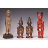 Four West African statues;