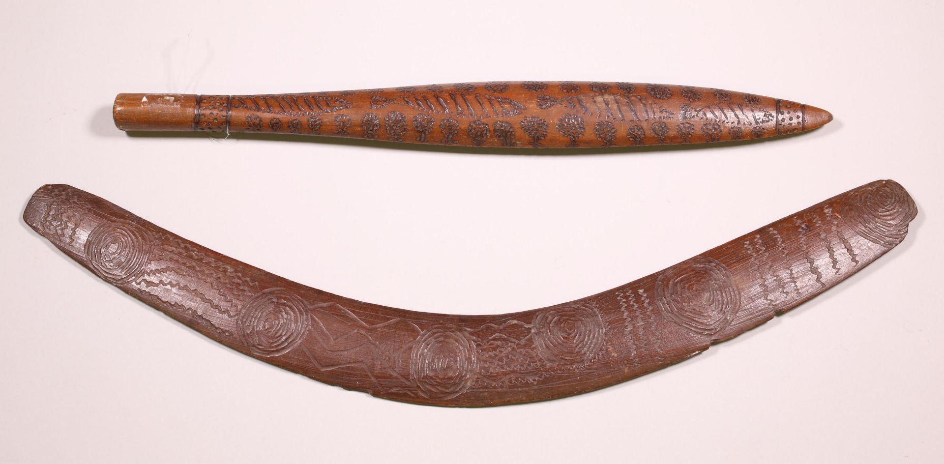 Australia, Aborigin wooden club with a poker work pattern and a boomerang