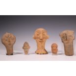 Ghana, Akan, three terracotta funerary heads and two West African terracotta heads.