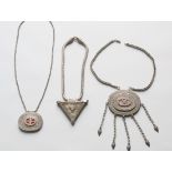 Kazachstan, three amulet containers on a chain;