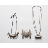 India, two silver amulet containers and a Persian silver amulet container;