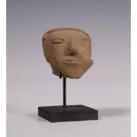 Colombia, Narino, earthenware head of a Shaman with coco leaves in his left cheek