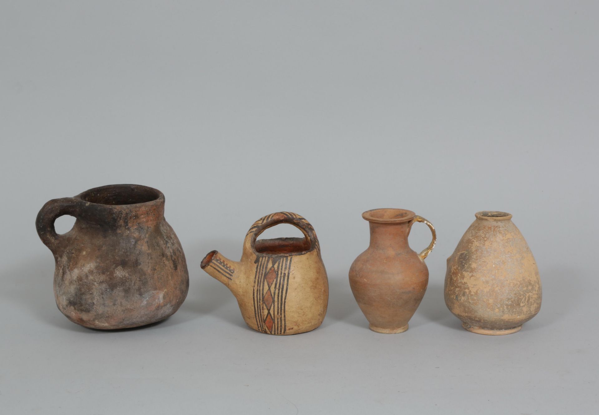 Two antique terracotta jars and North African, one clay pot and one jar.