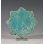 Perzie, antiek turquoise stervormige tegeltje.