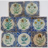 Acht polychroom aardewerk bloemdecortegels, tweede kwart 17e eeuw;