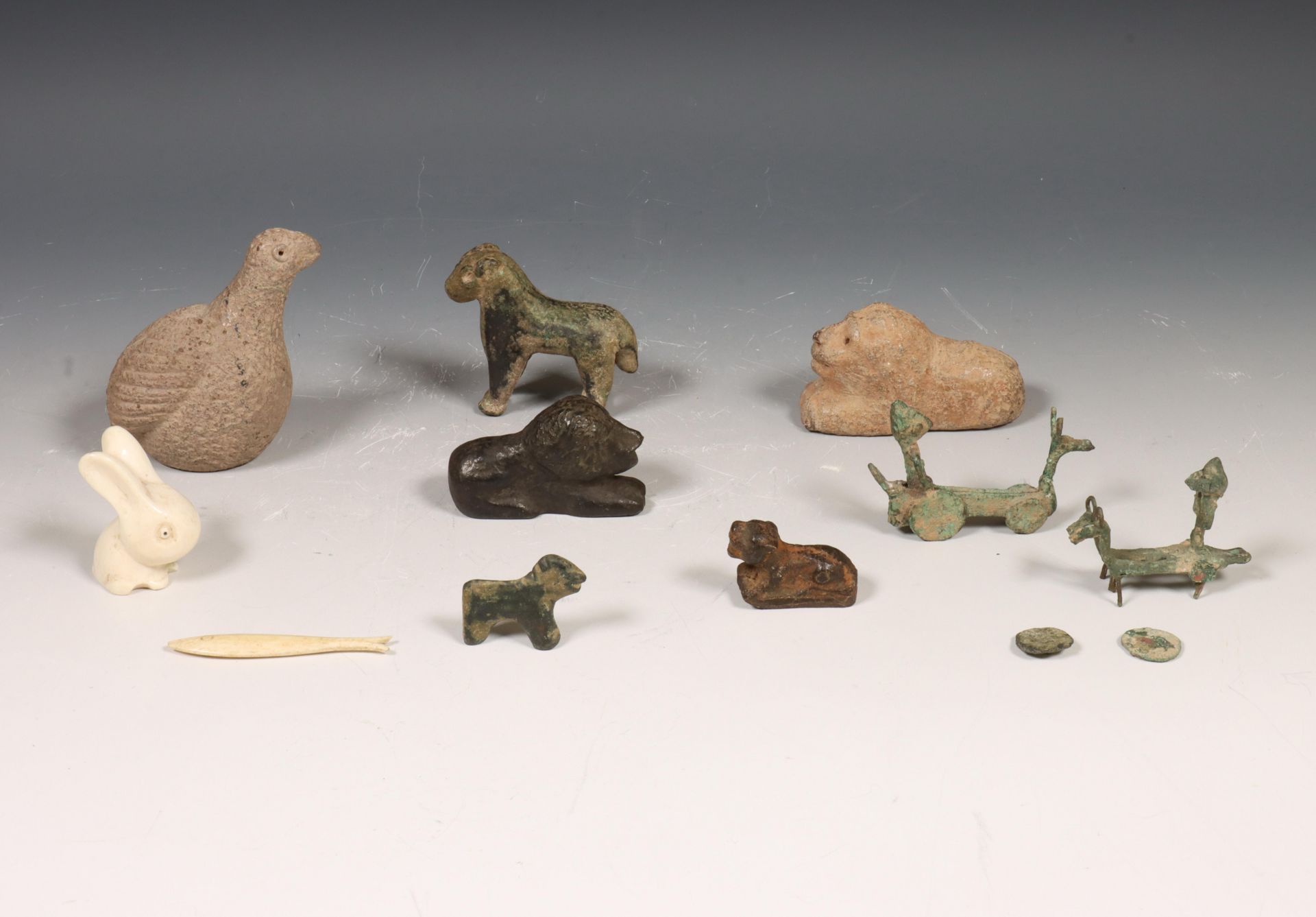 Collection of eight animal figures and two bronze horseman.